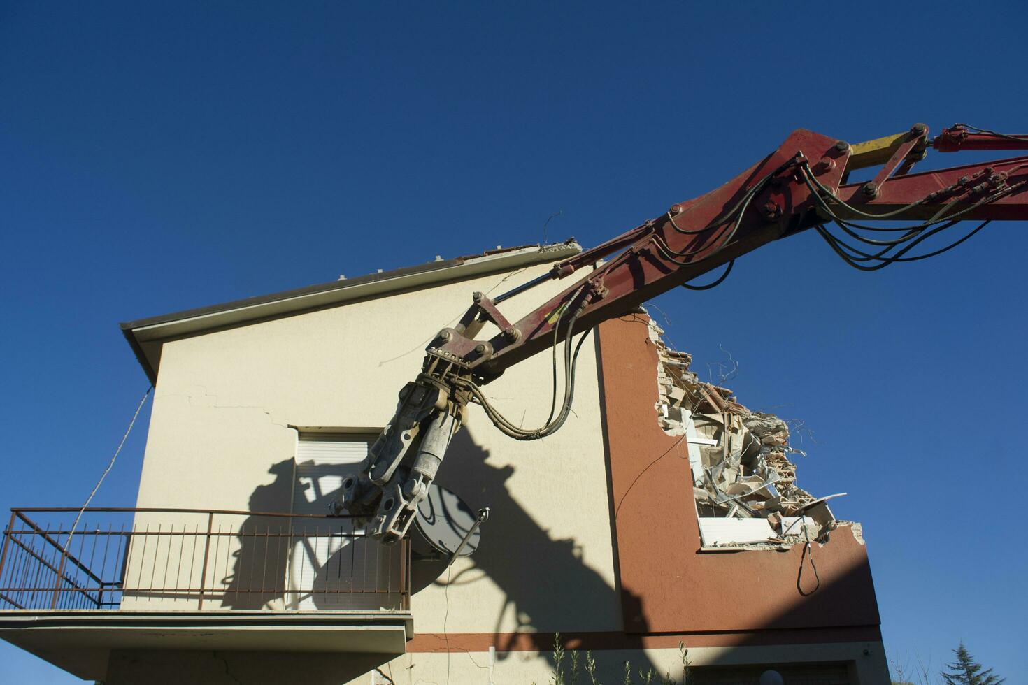 The controlled demolition of a house photo