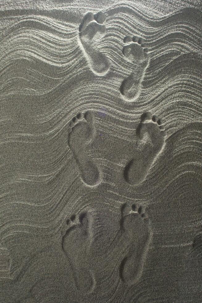 Foot prints in the sand photo