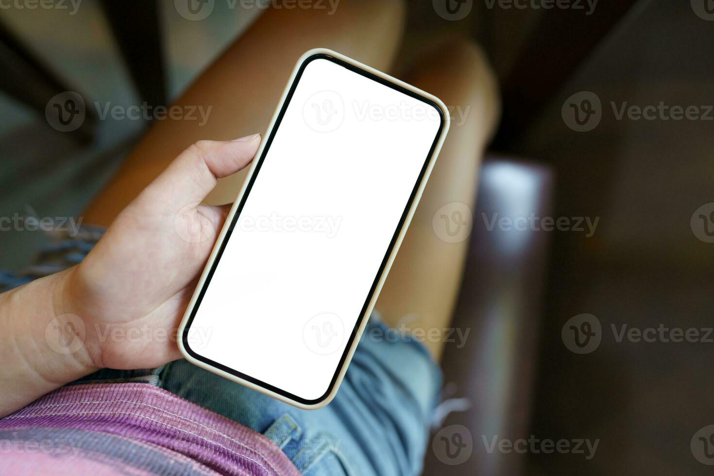 Close up of women's hands holding cell telephone blank copy space screen. smart phone with technology concept photo