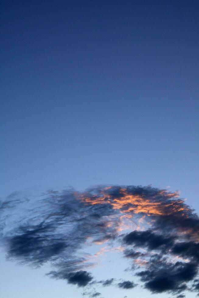 Small cloud at sunset photo