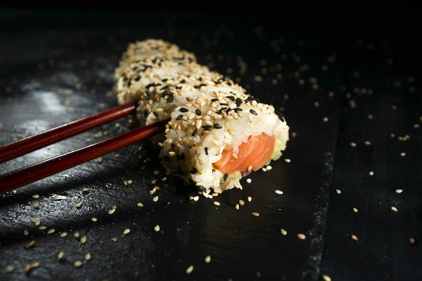 Sushi dish with chopsticks photo