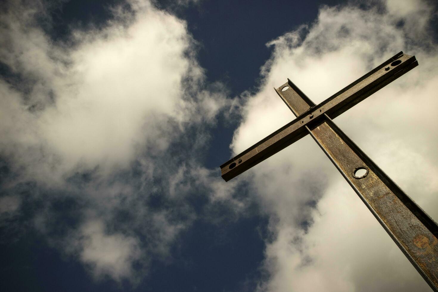 Iron cross and cloudy sky photo