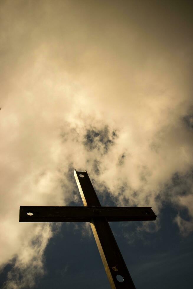 Iron cross and cloudy sky photo