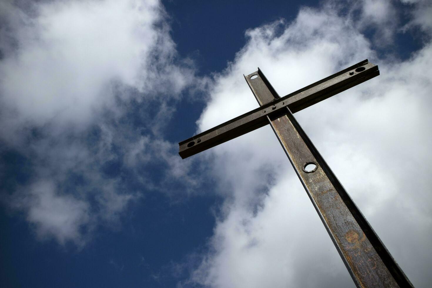 Iron cross and cloudy sky photo