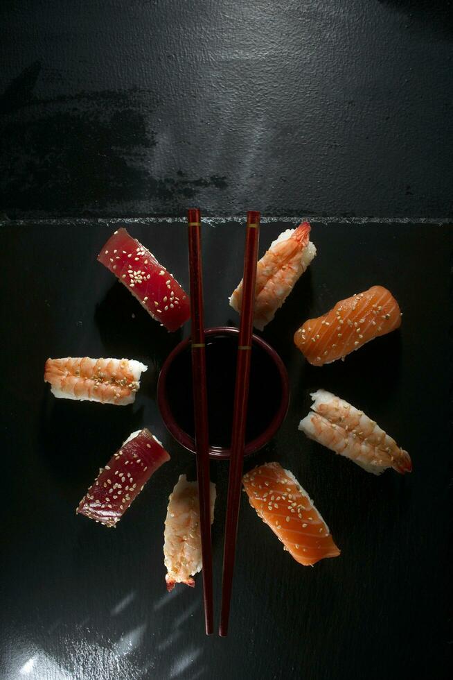 Circular sushi plate with chopsticks photo