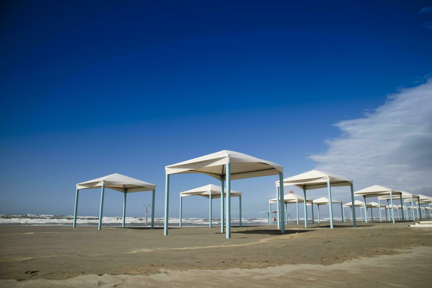 Autumnal view of the gazebos on the beach of Viareggio photo