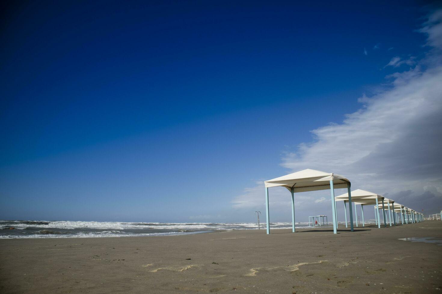 Autumnal view of the gazebos on the beach of Viareggio photo