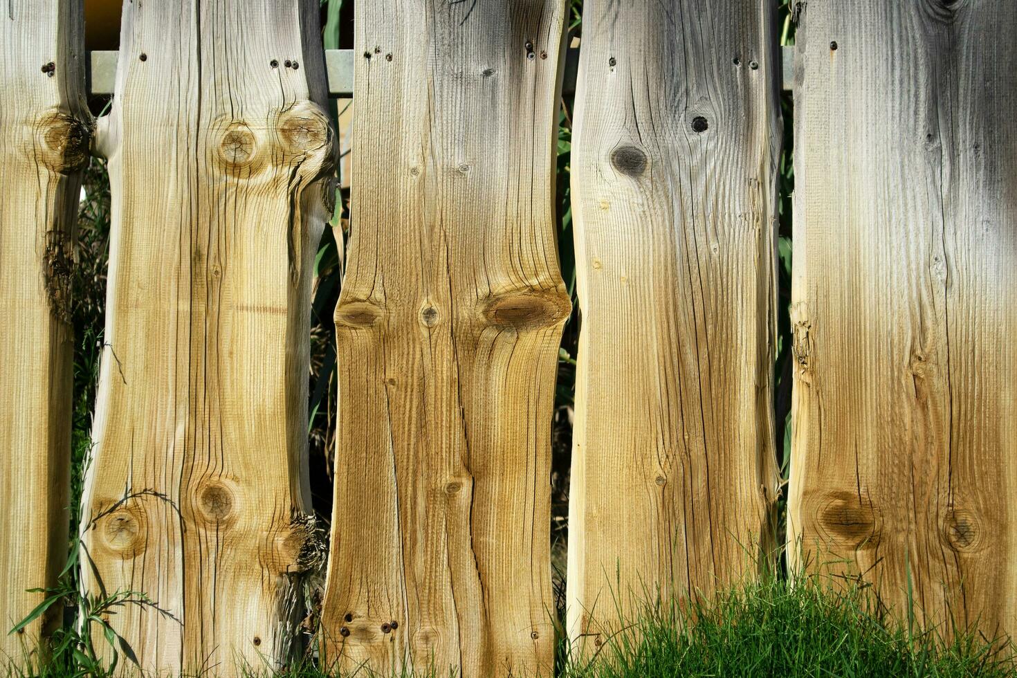 Fence made of wooden planks photo