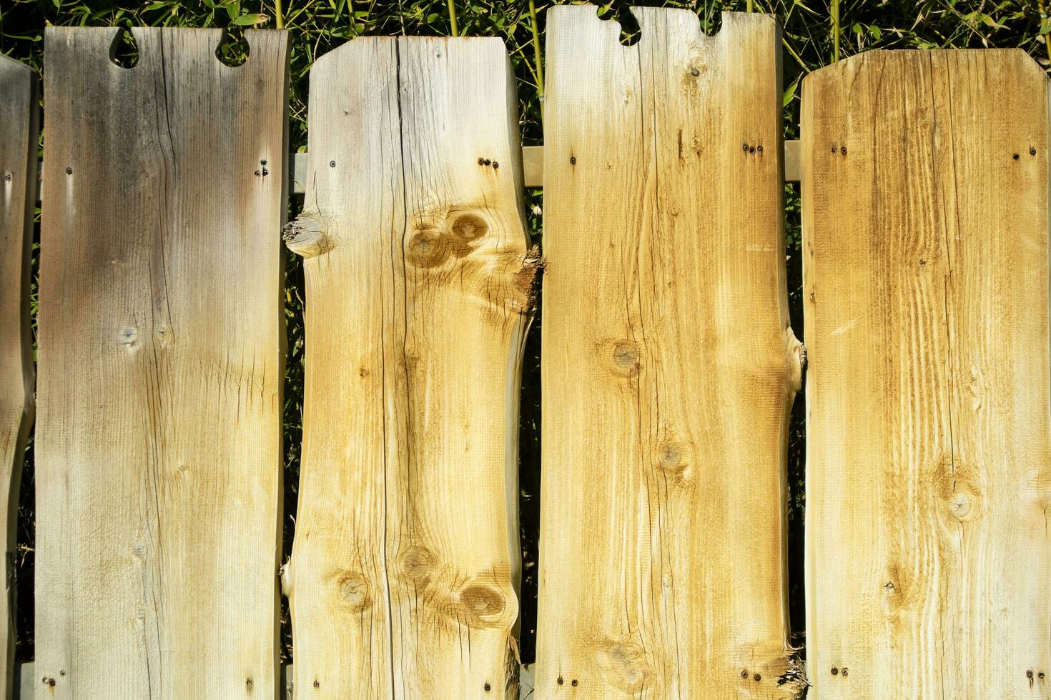 Fence made of wooden planks photo