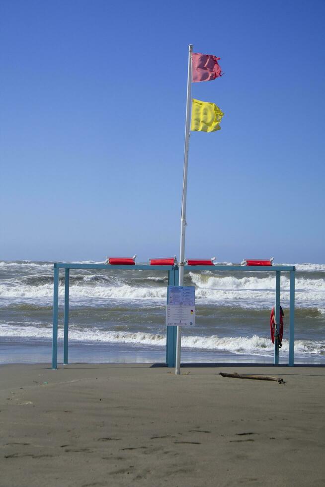 Hazard warning flags at sea photo