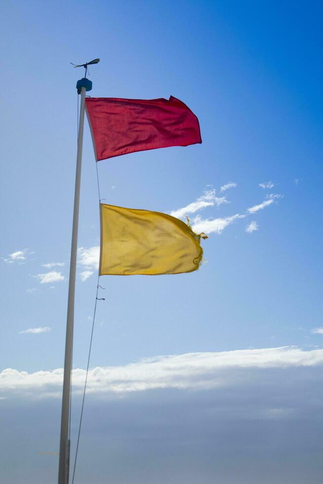 Hazard warning flags at sea photo