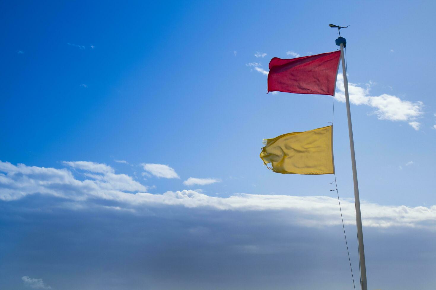 Hazard warning flags at sea photo