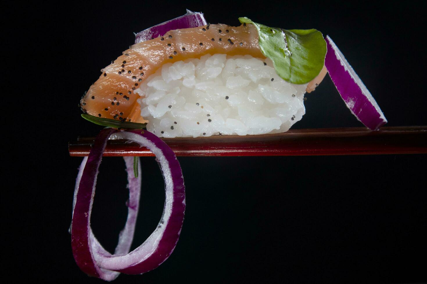 Sushi with red onion garnish photo