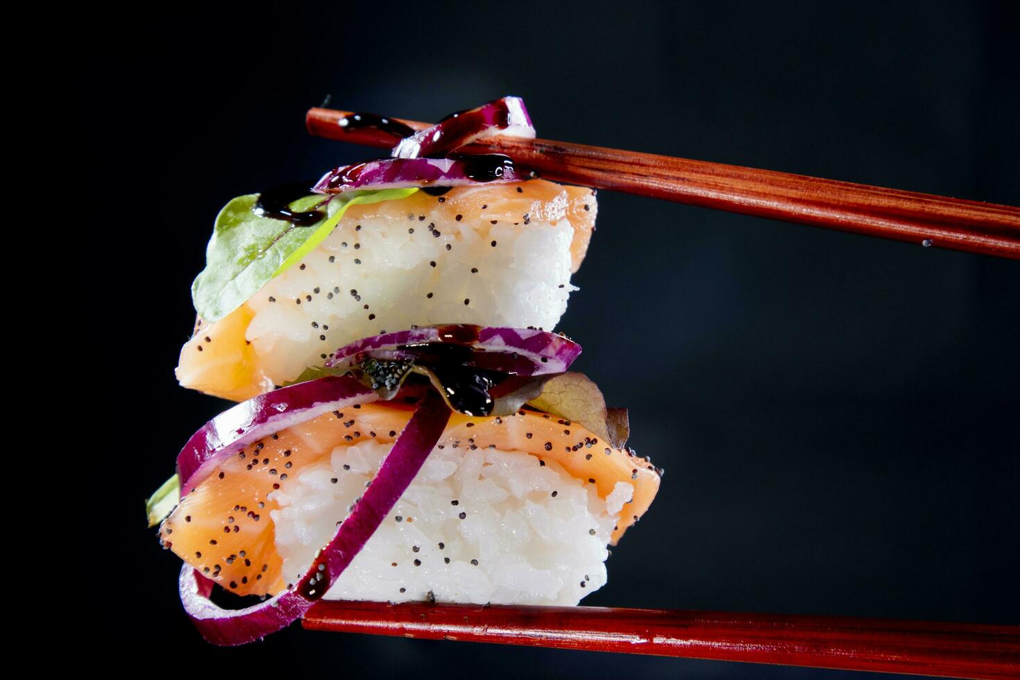 Sushi with red onion garnish photo