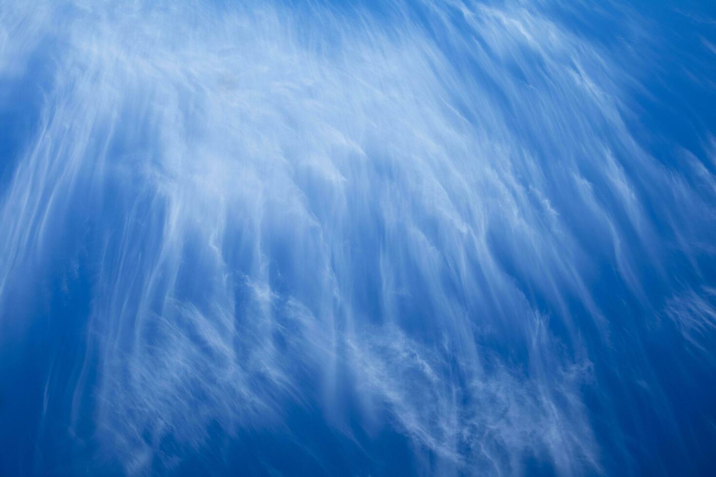 Sky with layered white clouds photo