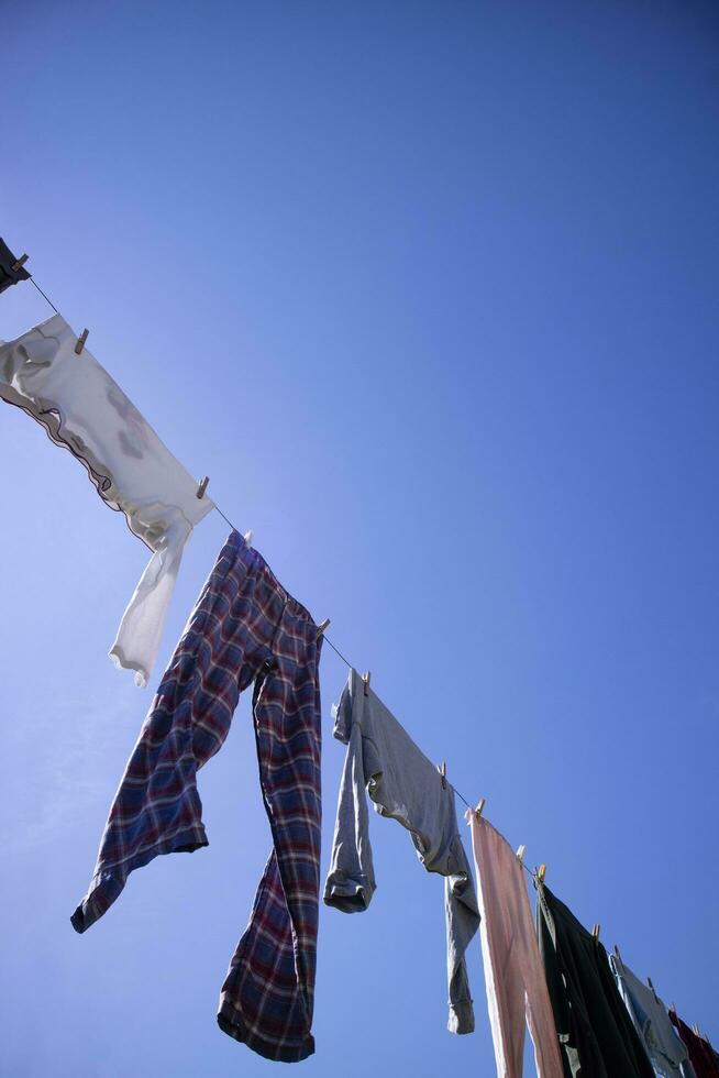 Laundry hanging out in the sun photo