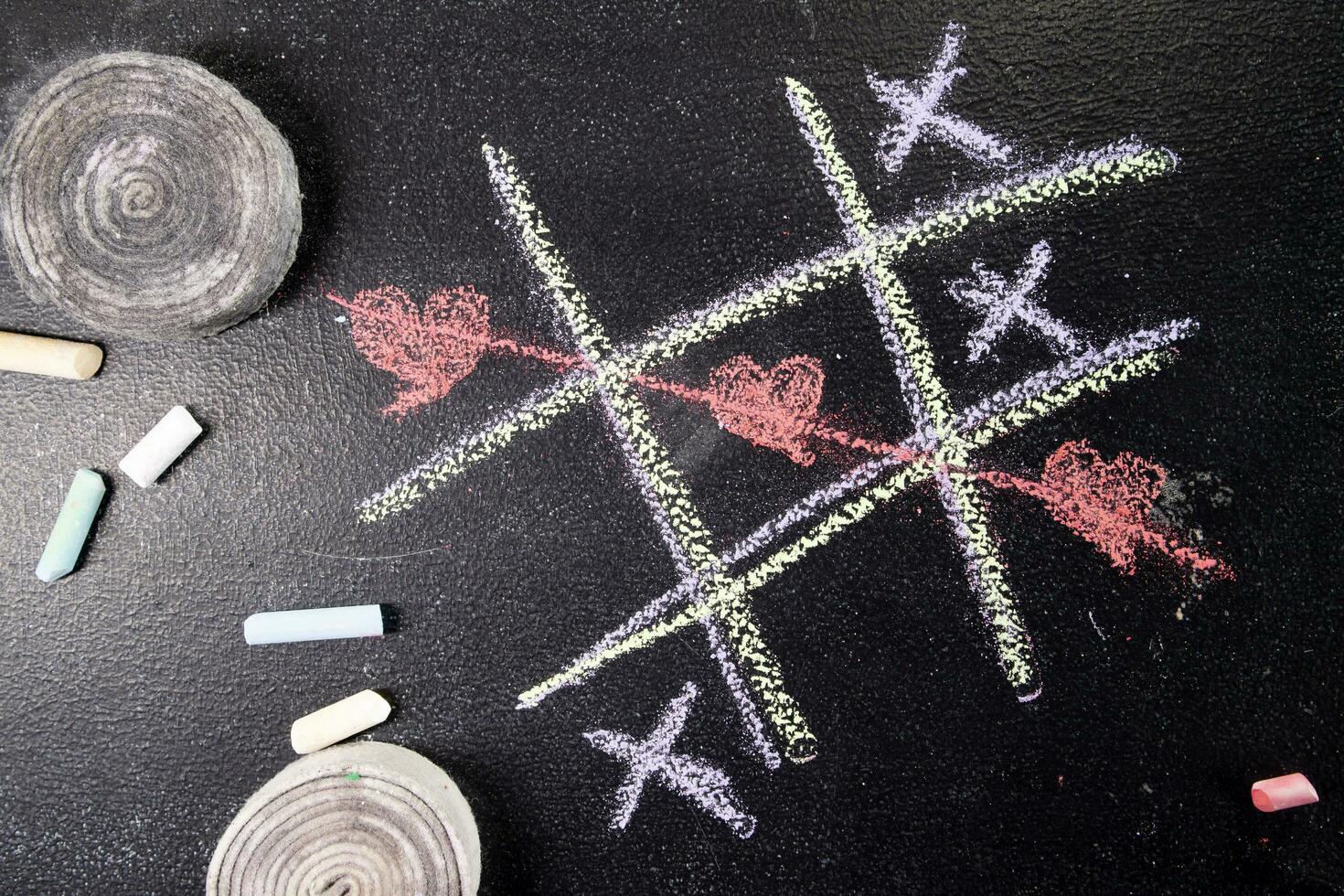 Tic-tac-toe game with heart as a symbol photo