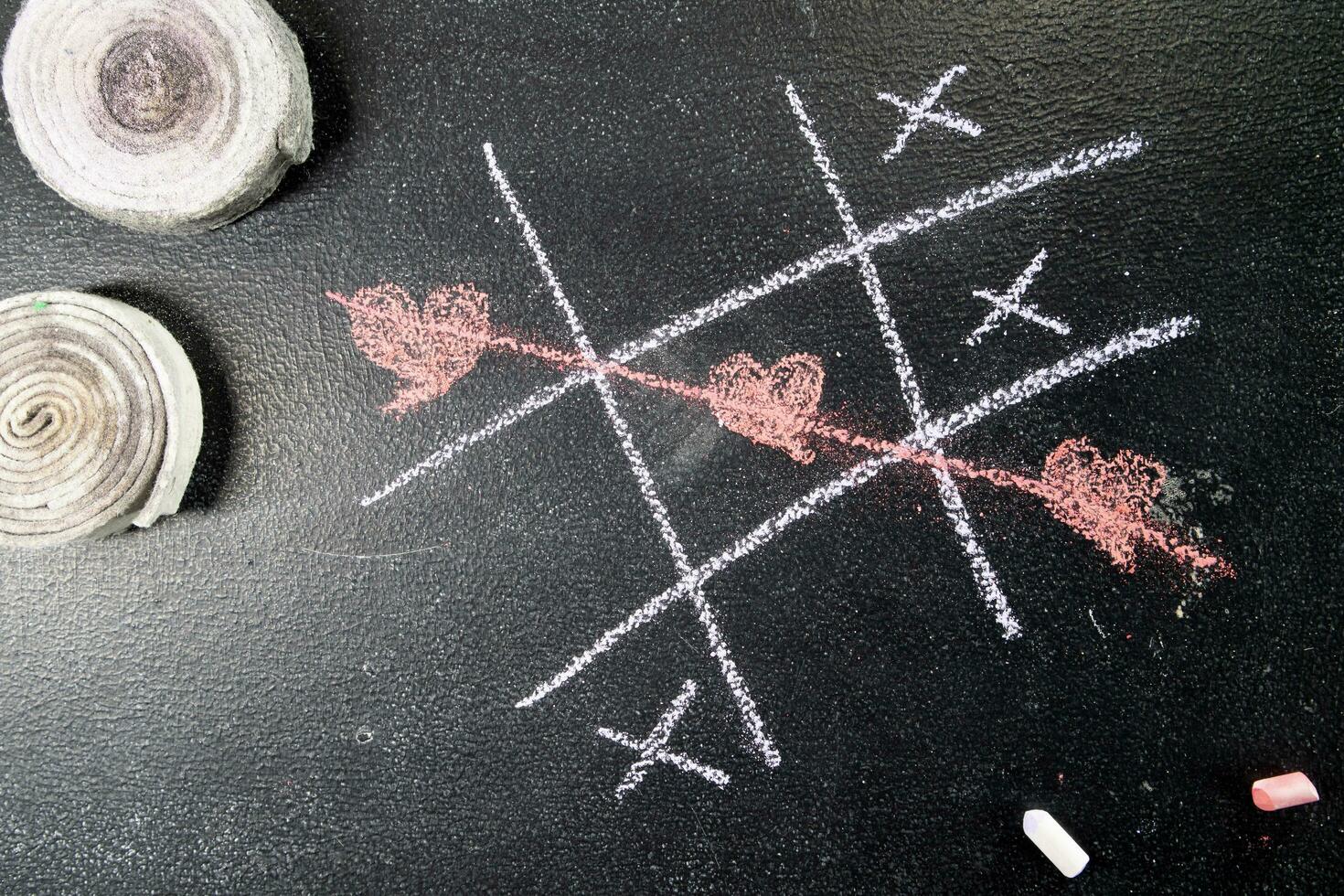 Tic-tac-toe game with heart as a symbol photo