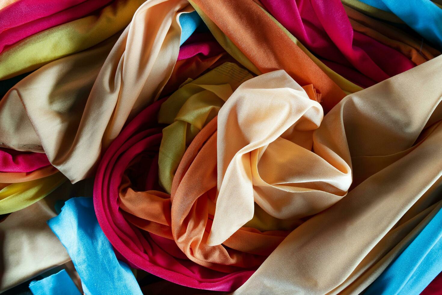 A group of multicolored cloth drapes photo