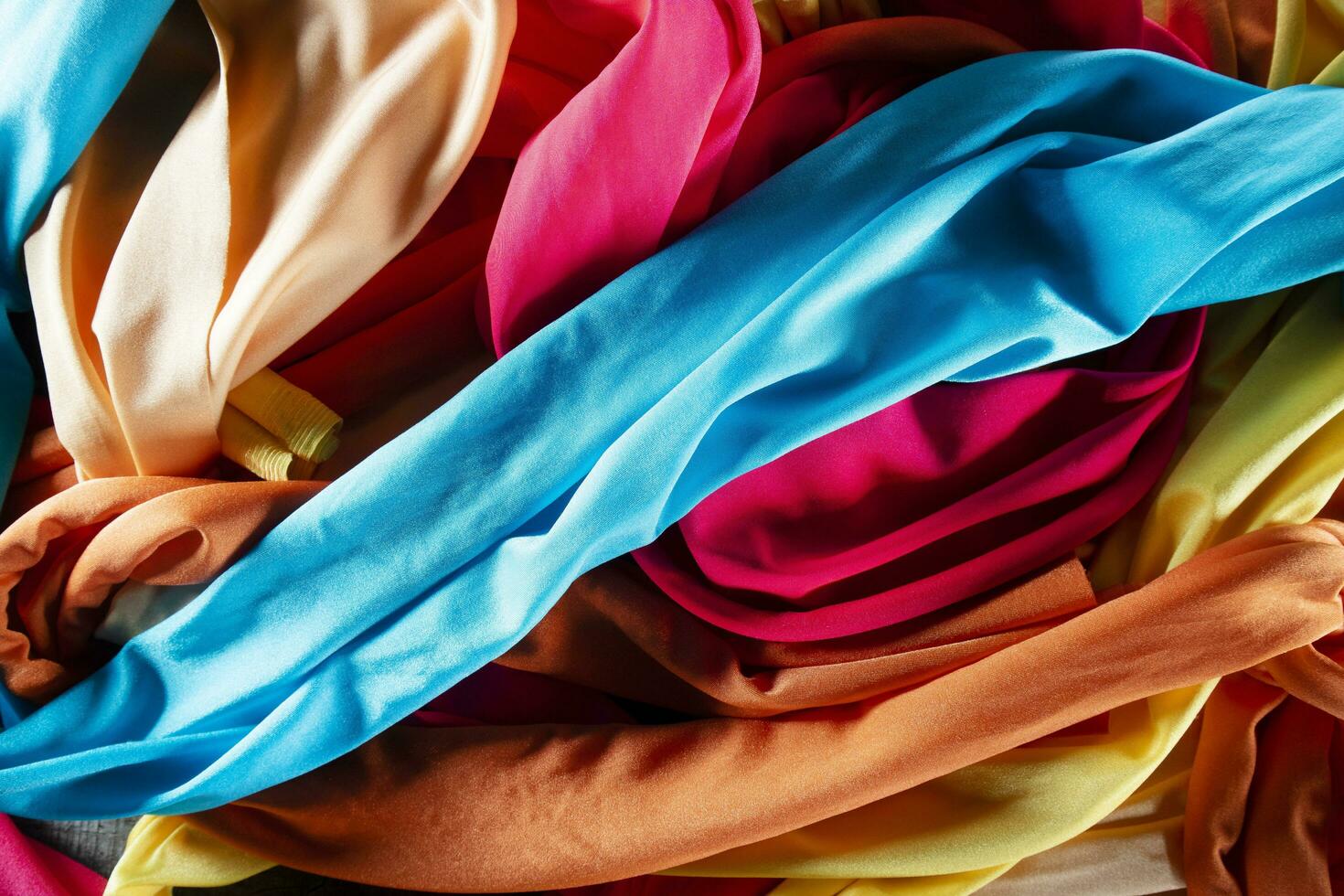 A group of multicolored cloth drapes photo