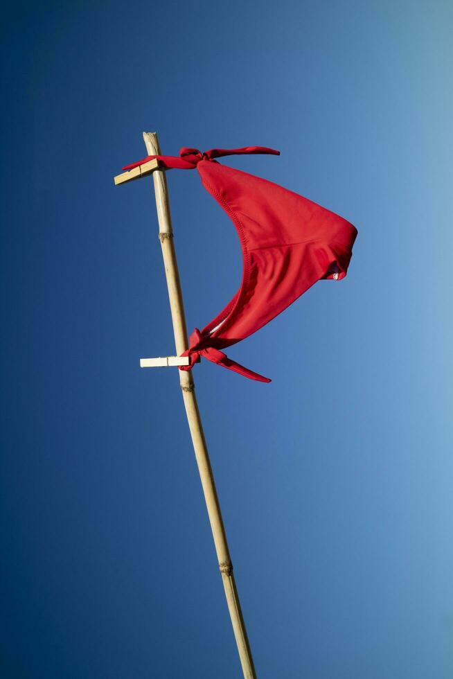 Women's swimsuit to dry in the wind as a flag photo