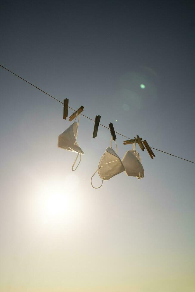 Wash and dry the anti-Coronavirus masks against the light photo