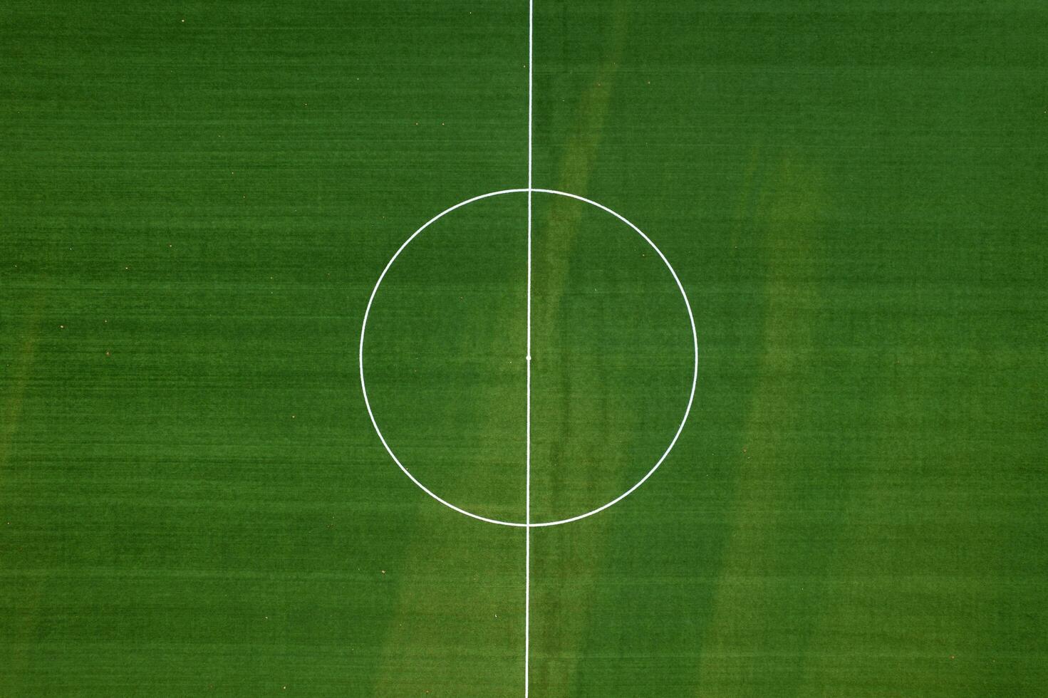 Aerial view of a green field for playing football photo