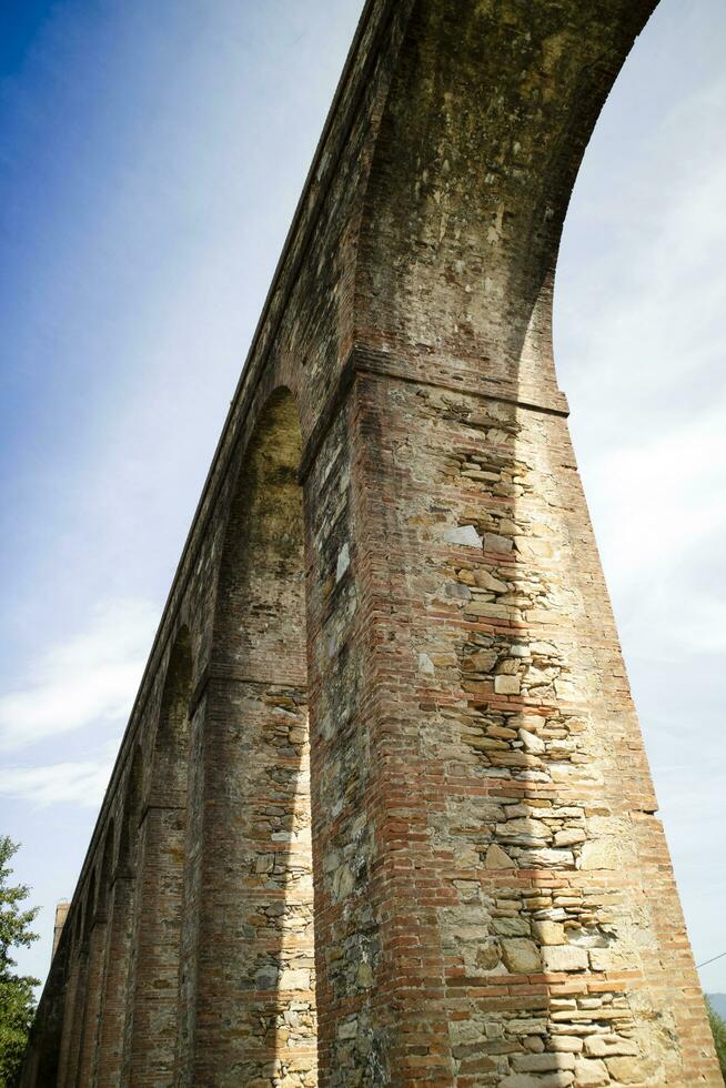 Ancient aqueduct in the province of Lucca Italy photo