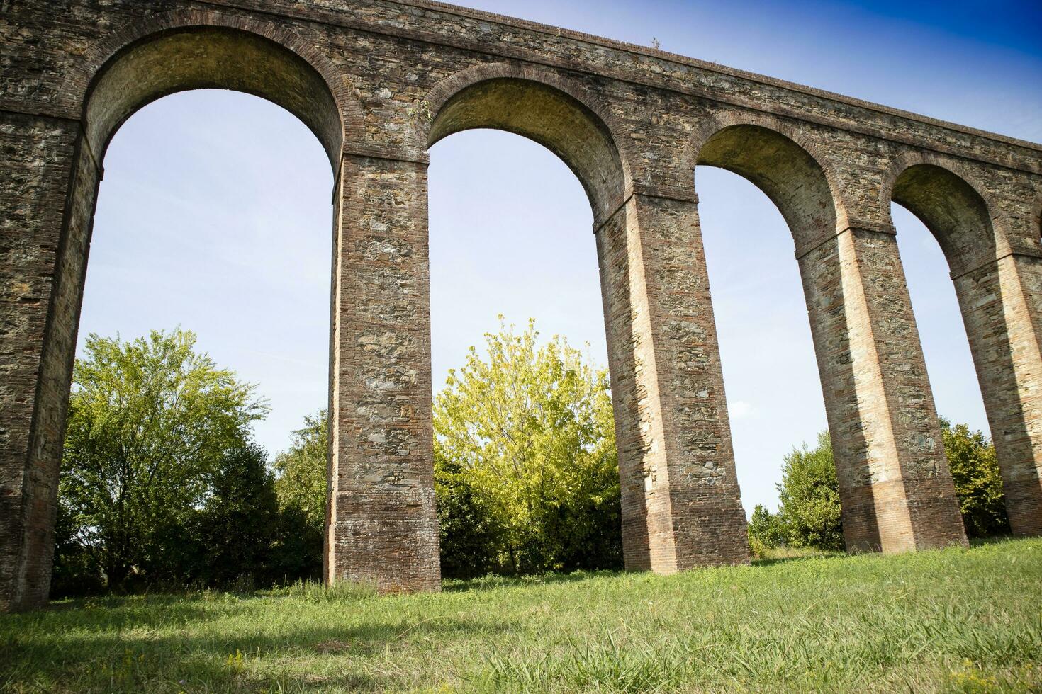 Ancient aqueduct in the province of Lucca Italy photo