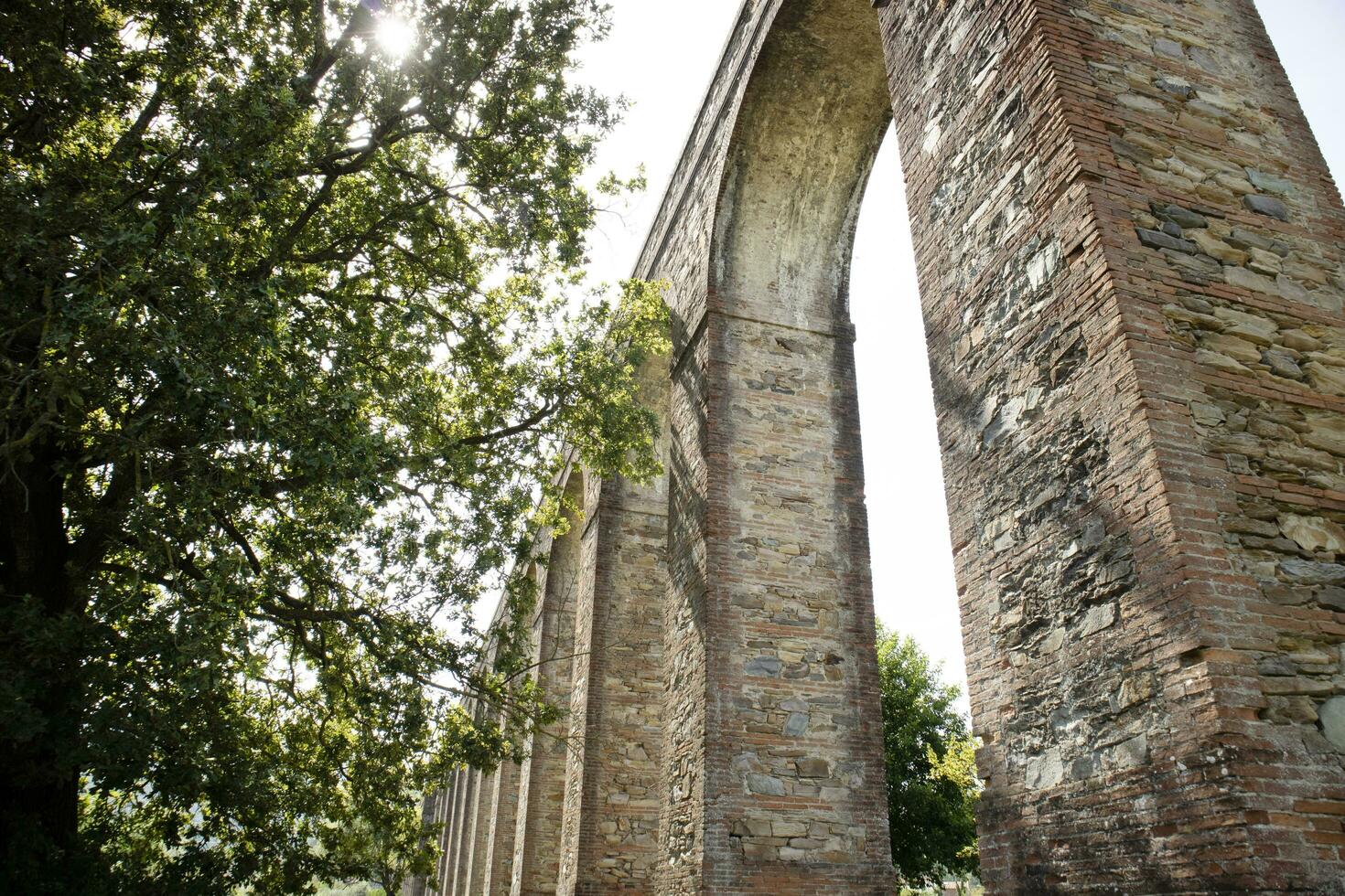 Ancient aqueduct in the province of Lucca Italy photo