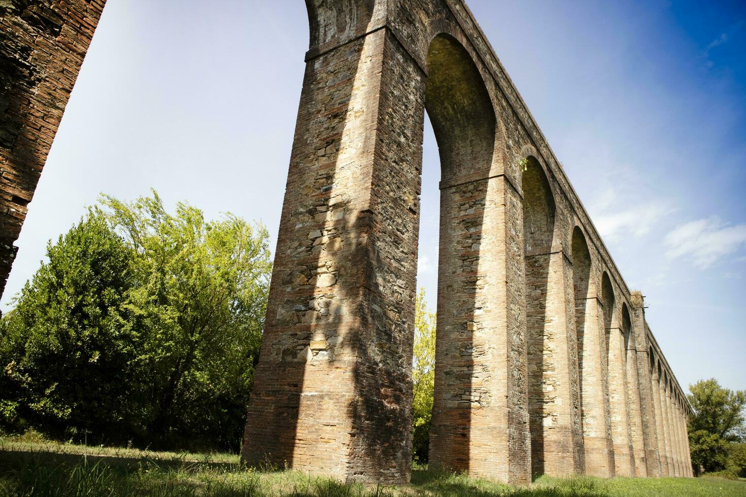 Ancient aqueduct in the province of Lucca Italy photo