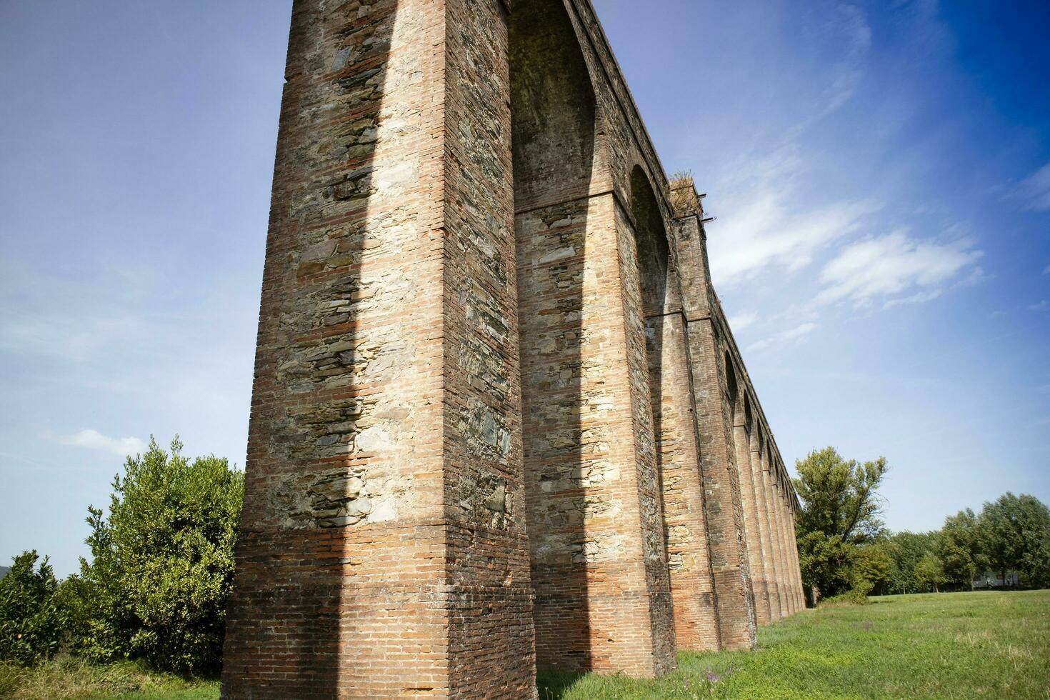 Ancient aqueduct in the province of Lucca Italy photo