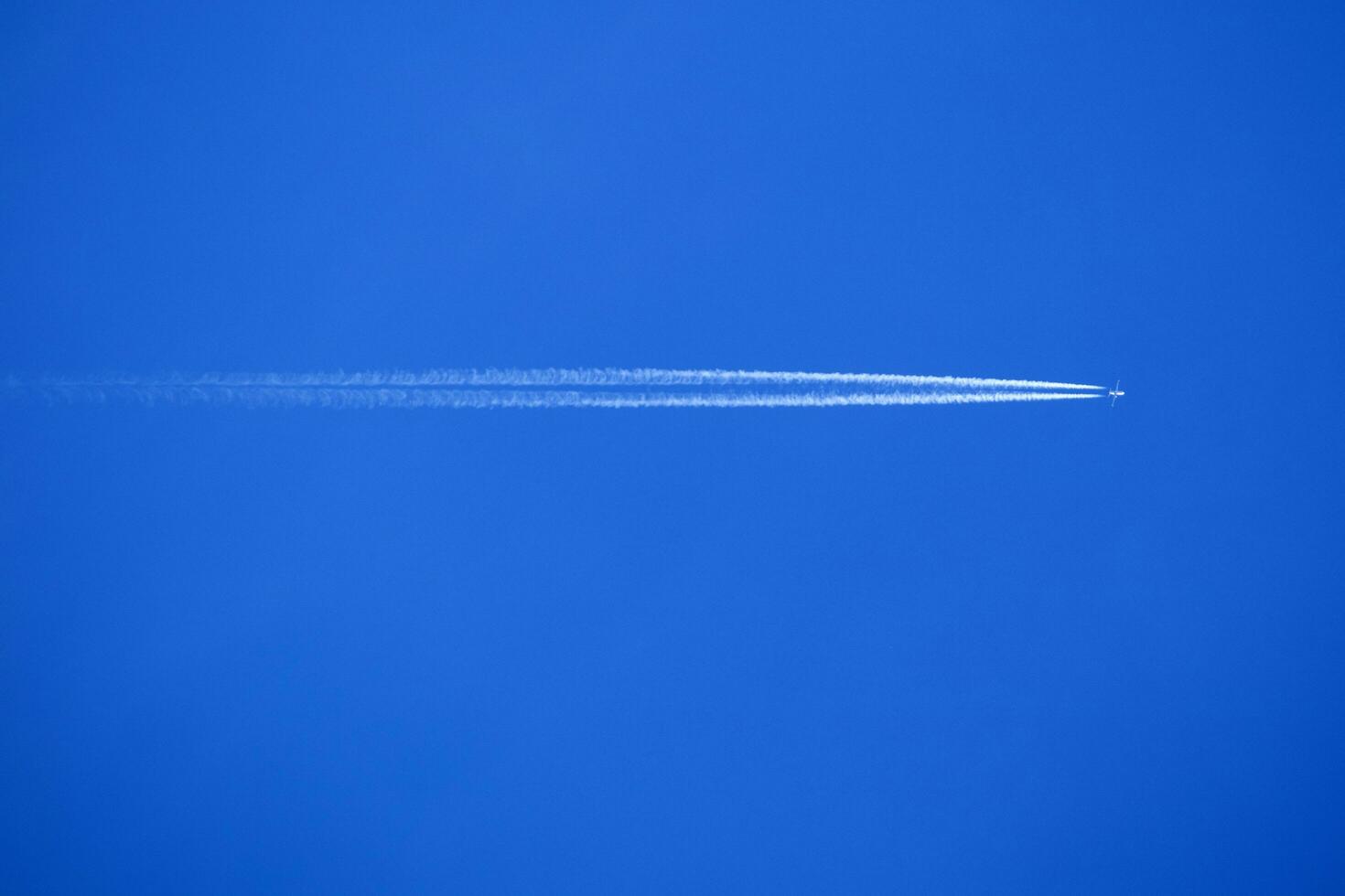 The trails in the sky that leave the planes in flight photo