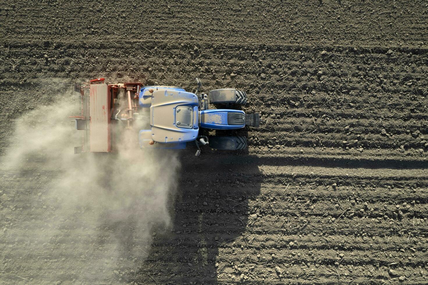 Aerial view of a tractor in the moment of sowing photo