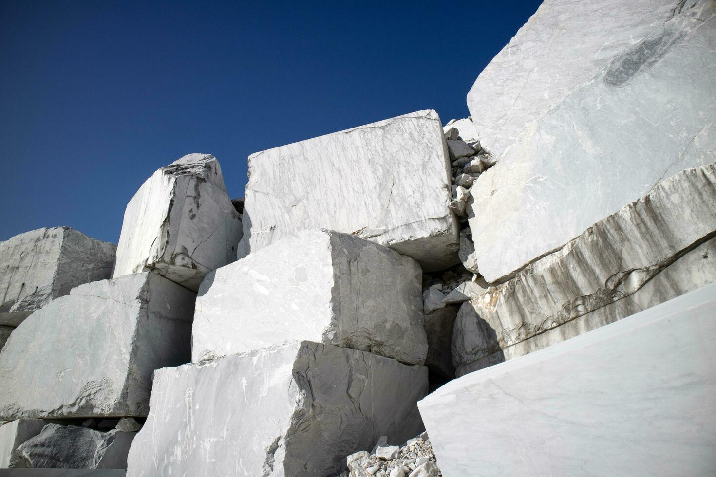 Storage of freshly extracted blocks of white statuary marble photo