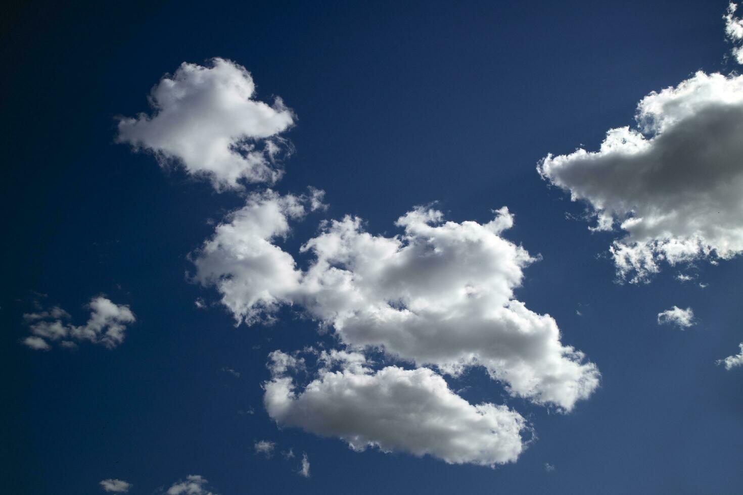 Photographic documentation of some clouds in a blue sky photo