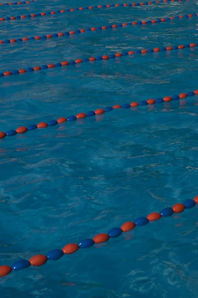 a blue swimming pool with orange and red lines photo
