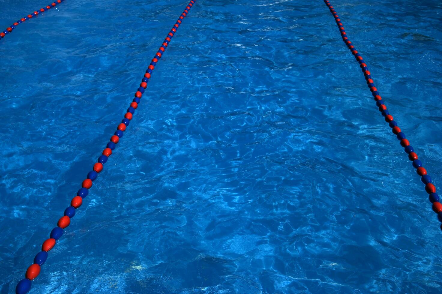 a blue swimming pool with orange and red lines photo