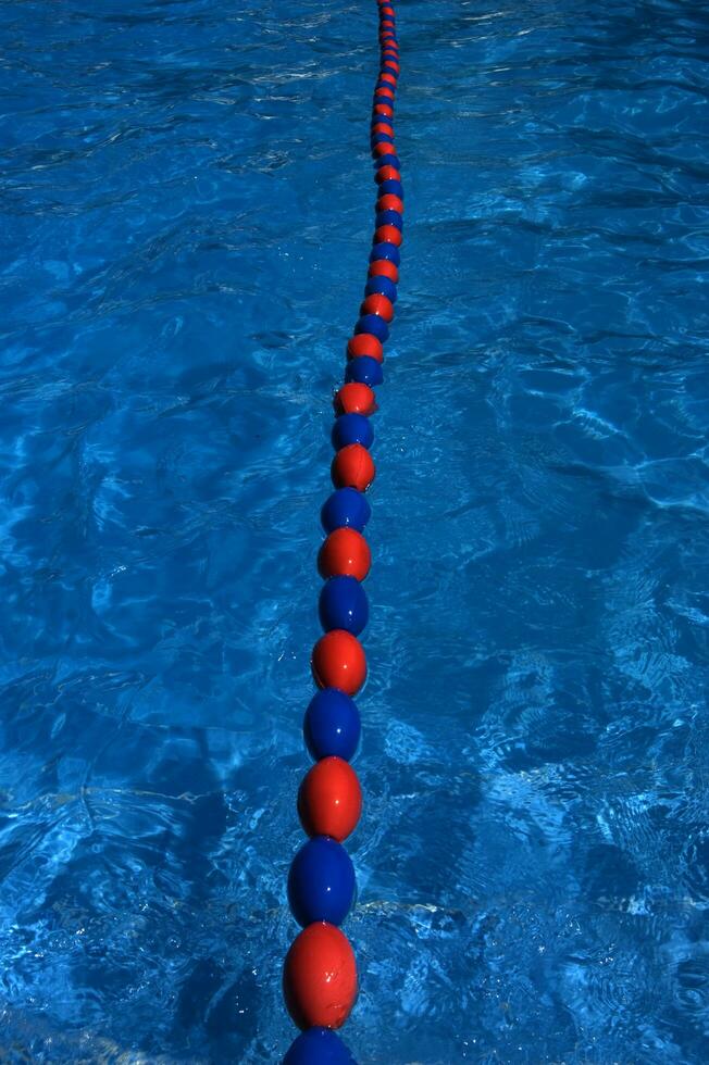 a blue swimming pool with orange and red lines photo