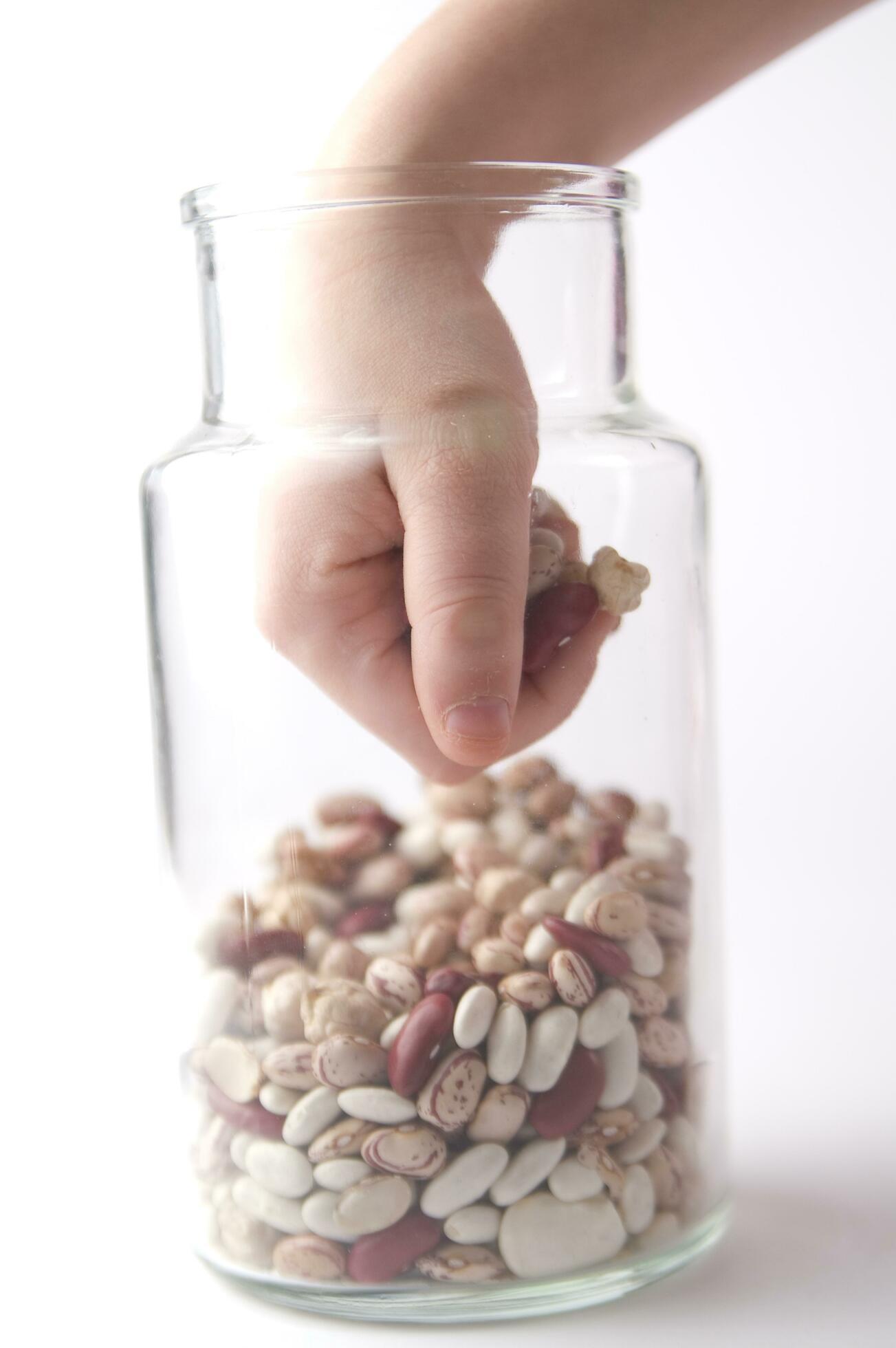 a jar of beans and a glass jar with beans 27092201 Stock Photo at Vecteezy