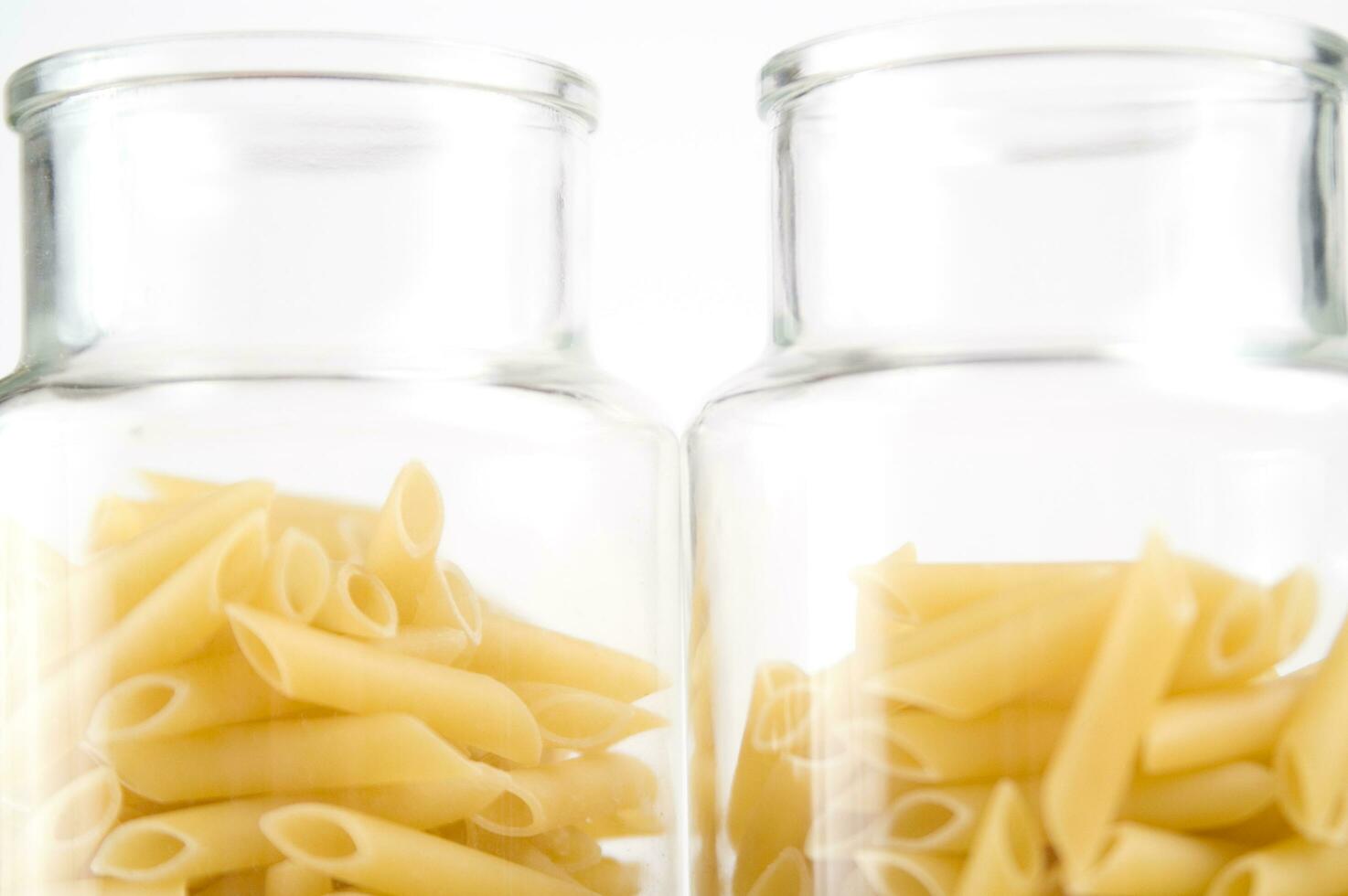 three glass jars filled with pasta photo