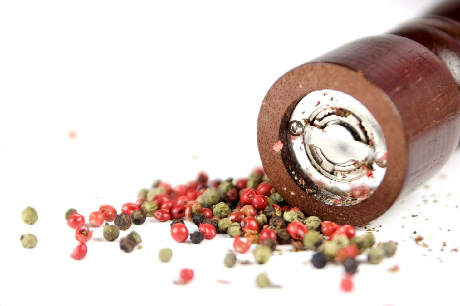 a close up of a pile of red and green peppers photo