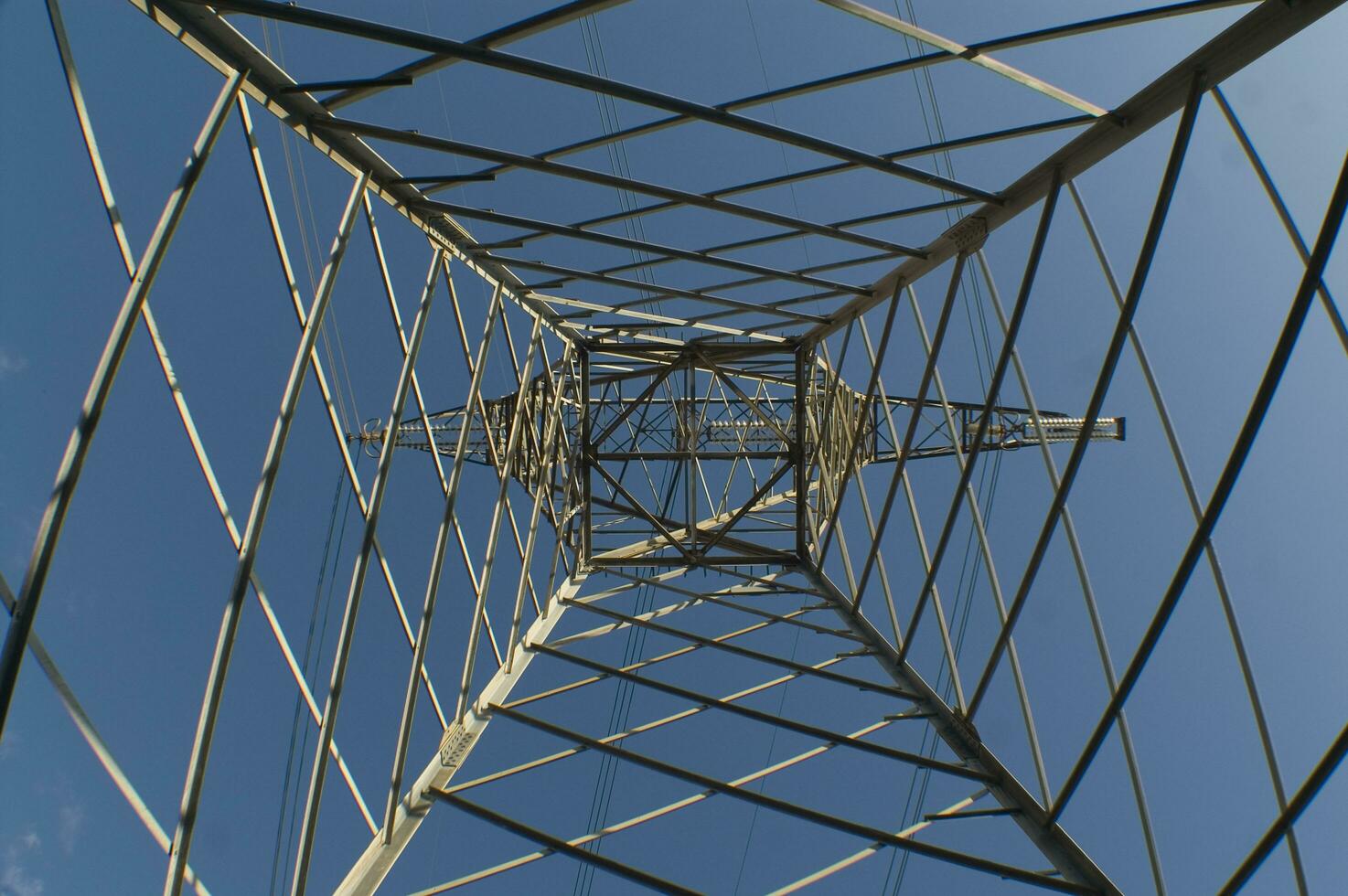 a large electrical tower with wires and wires photo