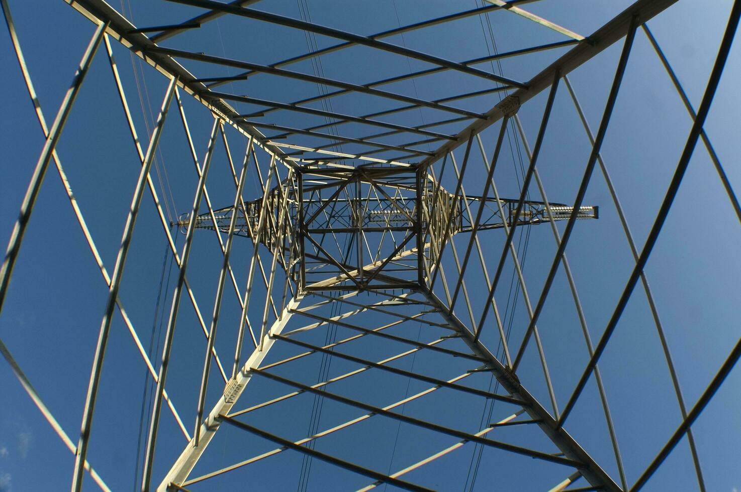 a large electrical tower with wires and wires photo
