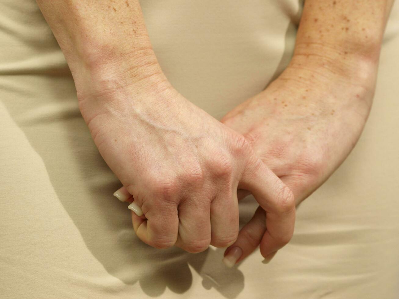 a woman is holding her stomach photo