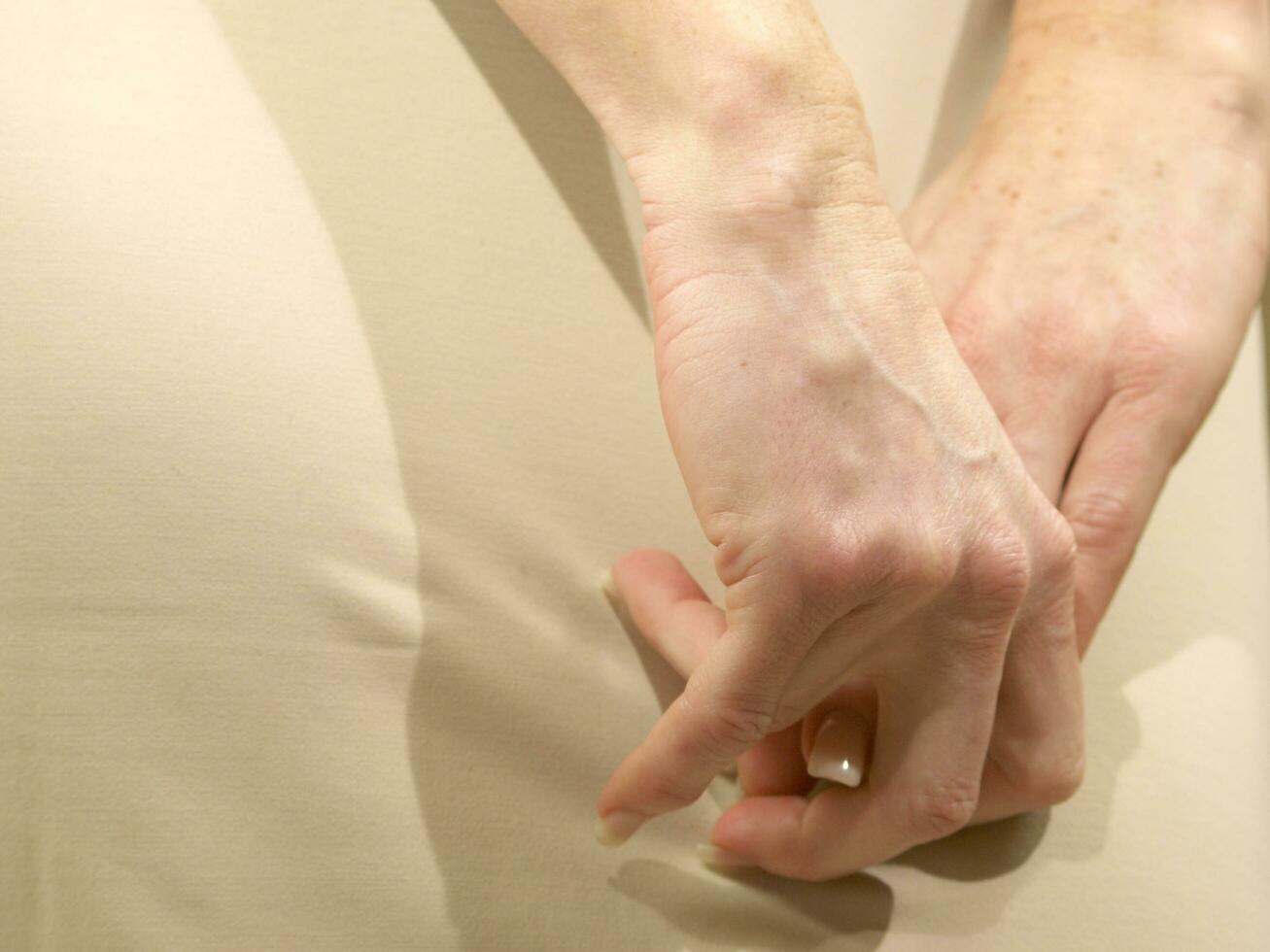 a woman is holding her stomach photo