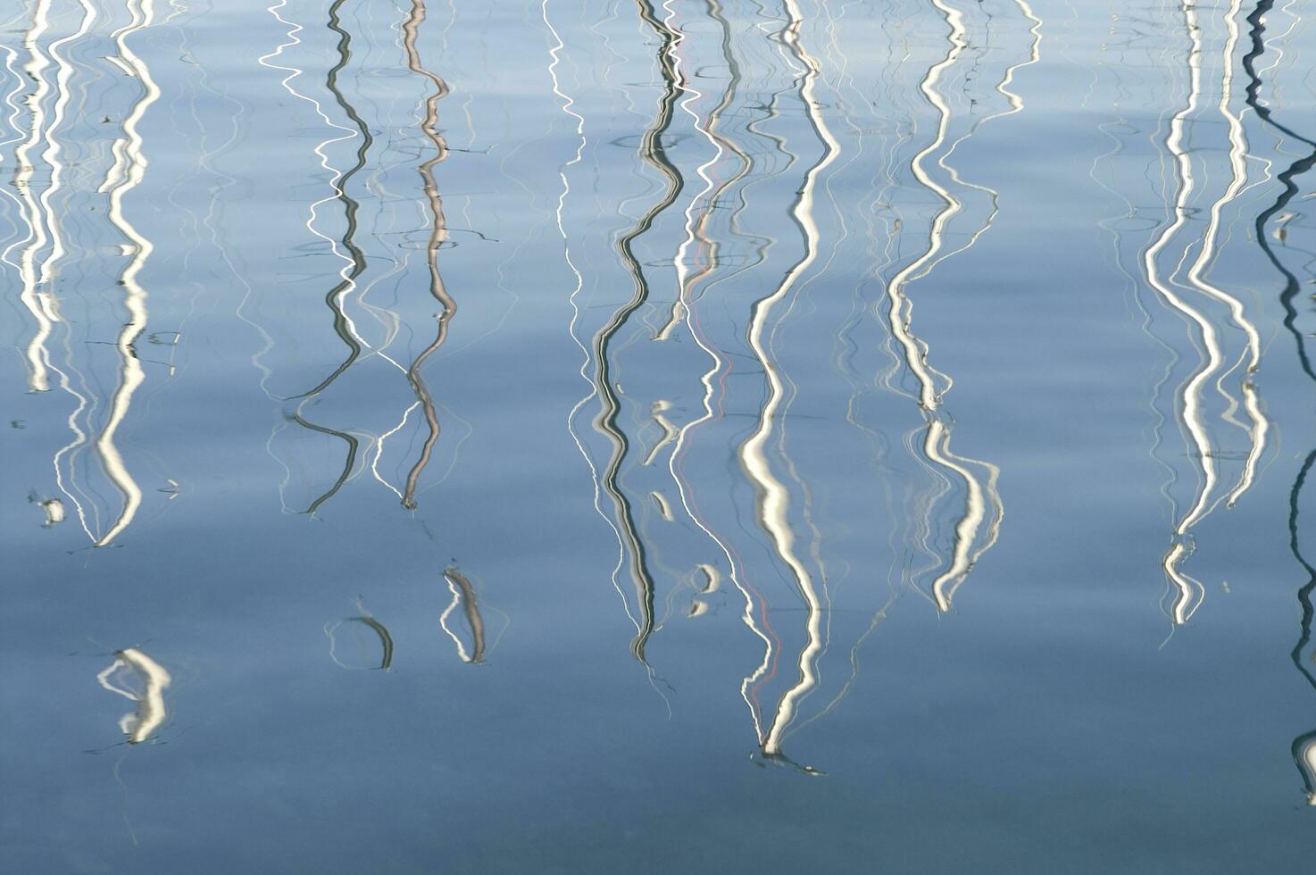 a reflection of a boat in the water photo