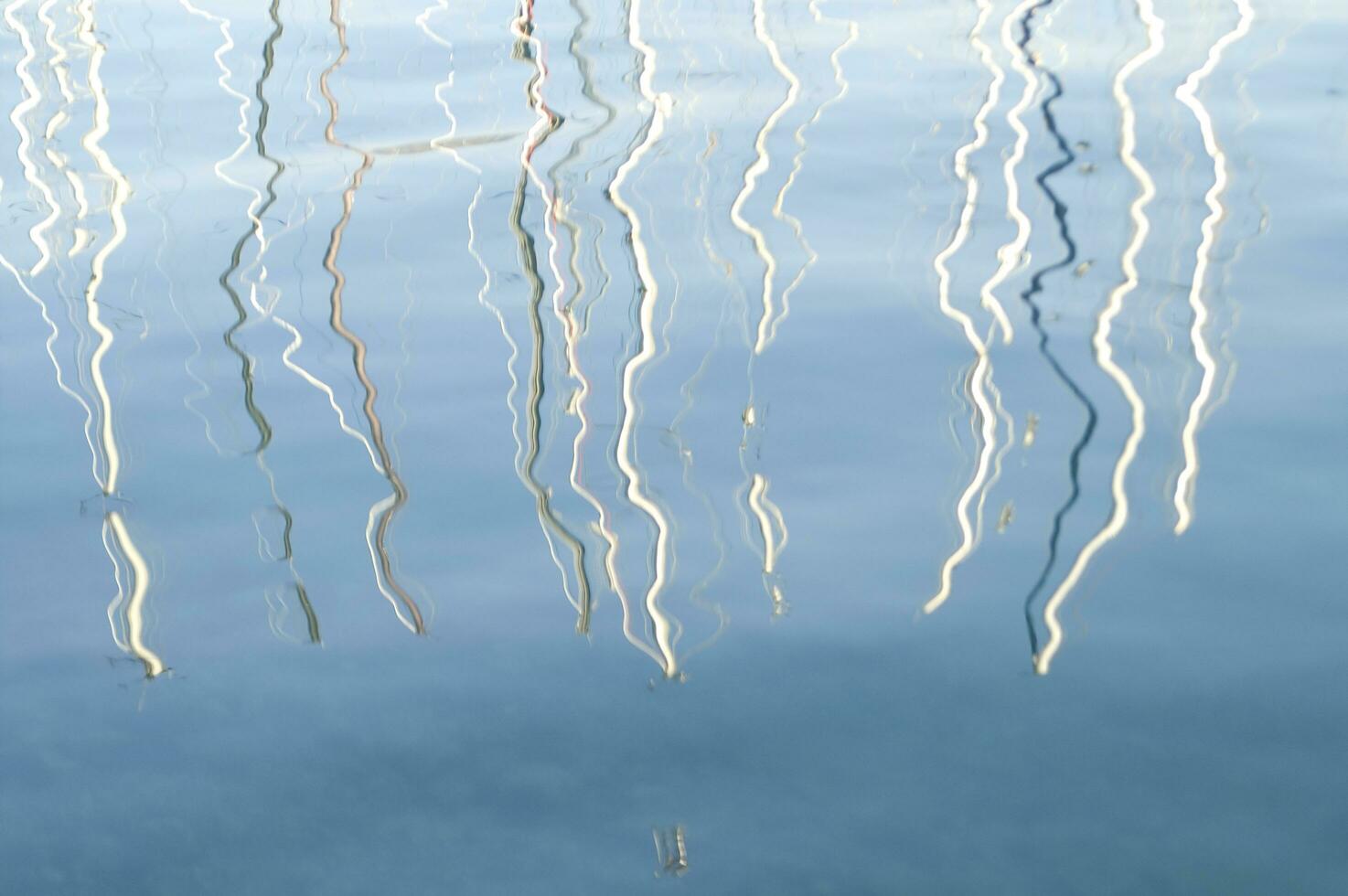 a reflection of a boat in the water photo