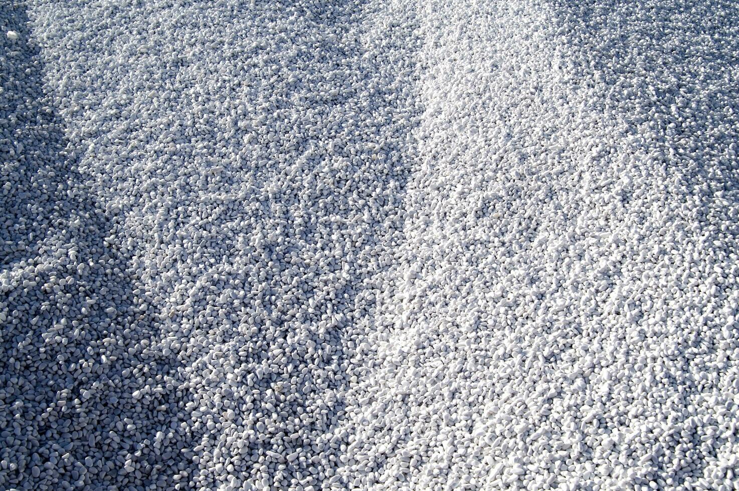 white pebbles are piled up in a pile photo