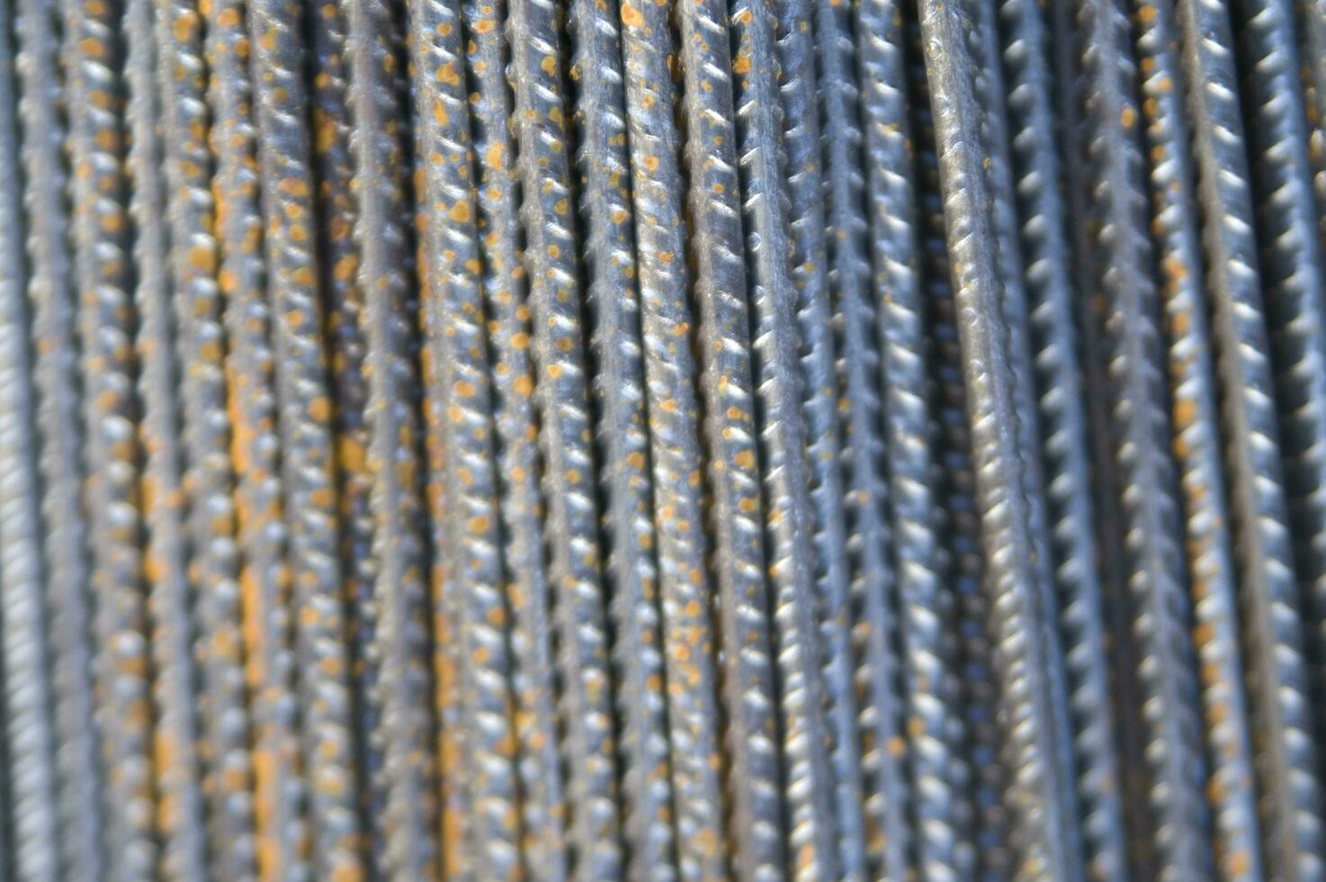 a pile of steel bars with rust on them photo